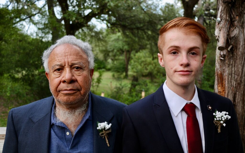 Grandfather and youngest grandson at wedding 